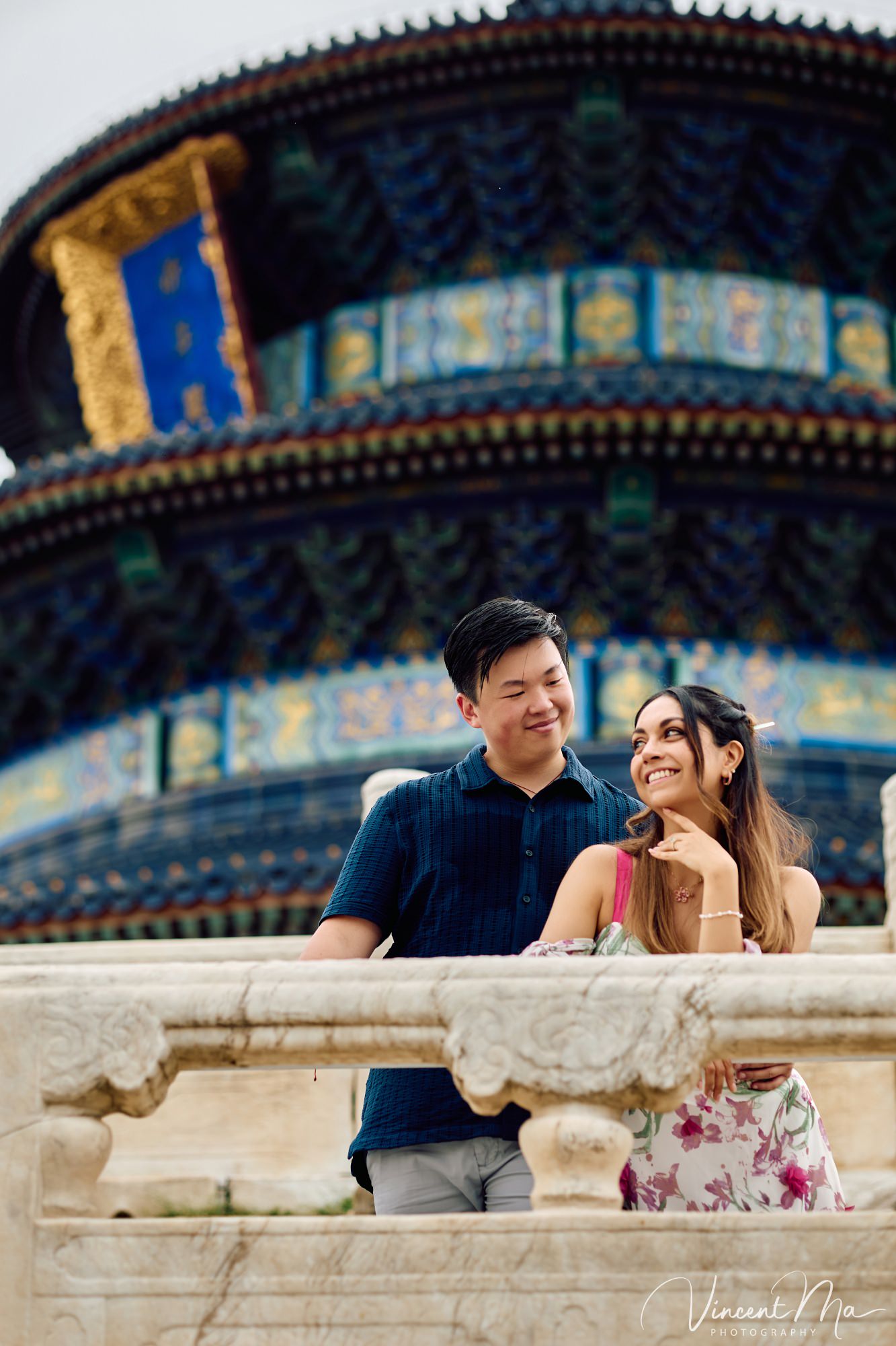 A foreign couple in traditional Chinese - style clothing, the man kneeling on one knee to propose to the woman in front of the majestic Hall of Prayer for Good Harvests in the Temple of Heaven