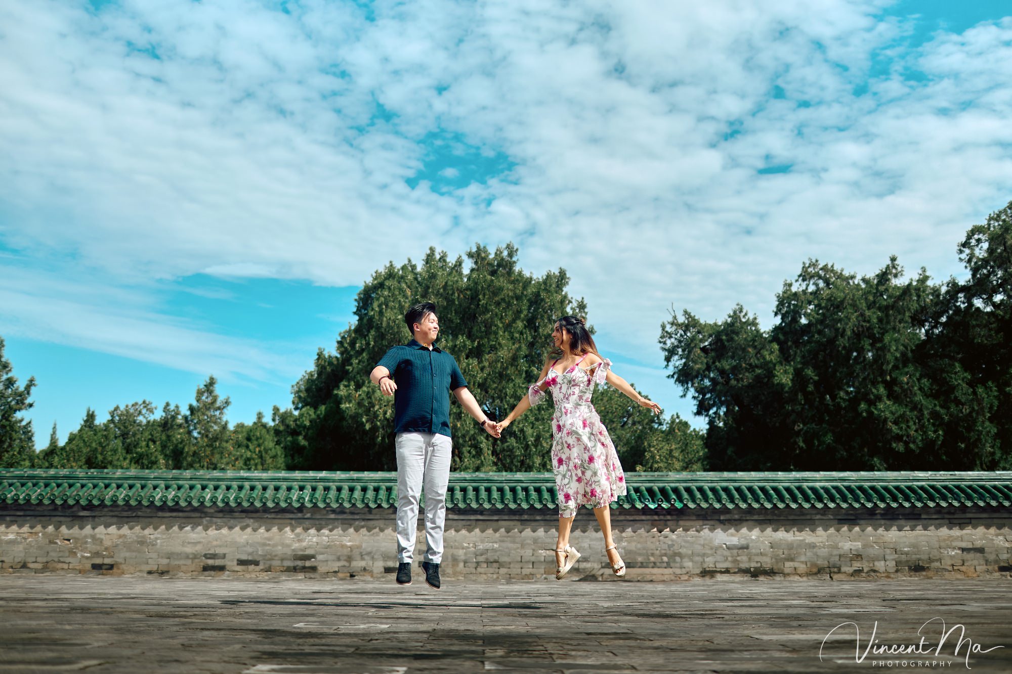 A foreign couple in traditional Chinese - style clothing, the man kneeling on one knee to propose to the woman in front of the majestic Hall of Prayer for Good Harvests in the Temple of Heaven