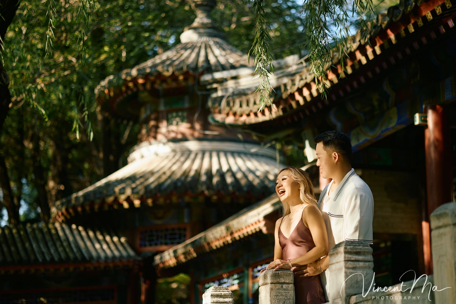 Couple enjoying a romantic moment at the Garden of Harmonious Interests in Beijing's Summer Palace, surrounded by traditional Chinese garden scenery with lakes and pavilions. Engagement shooting in summer palace.