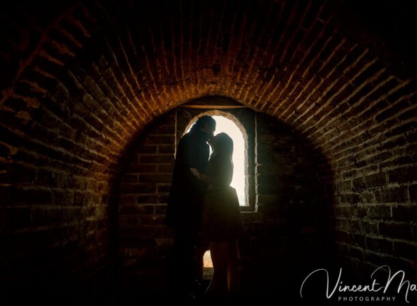 Surprise marriage proposal engagement shooting on Mutianyu Great Wall with ancient bricks and autumn leaves in background