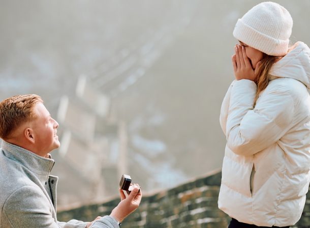South African couple proposal at Mutianyu Great Wall during first snow.